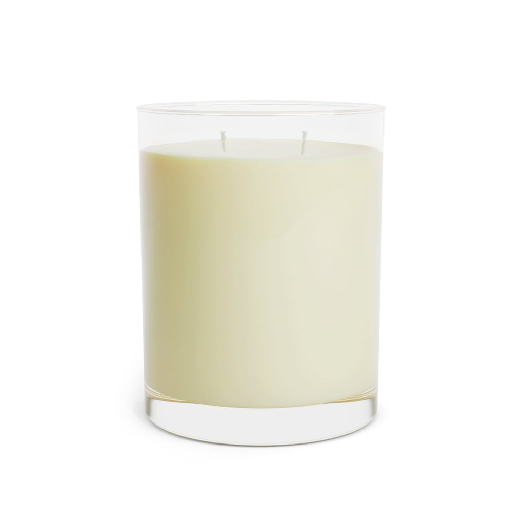 Clear glass soy wax candle with a white candle inside on a white background