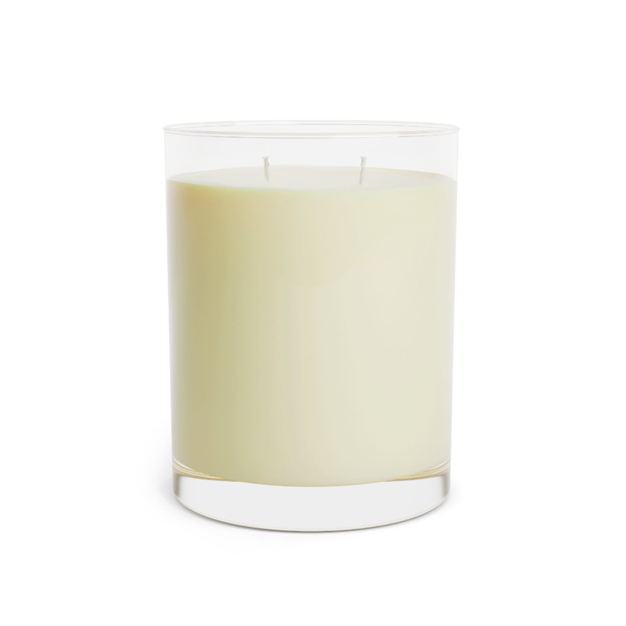 Clear glass soy wax candle with a white candle inside on a white background