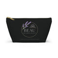 Black cosmetic travel pouch with 'BEAU Wellness & Beauty' logo on a white background