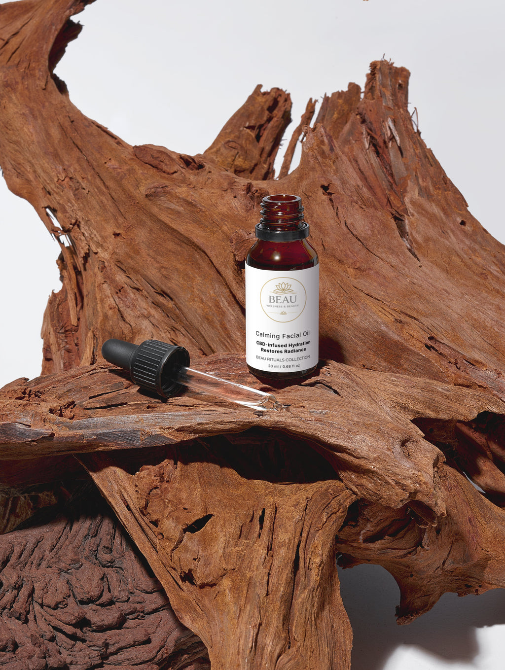 CBD calming facial oil bottle with dropper on a wooden surface