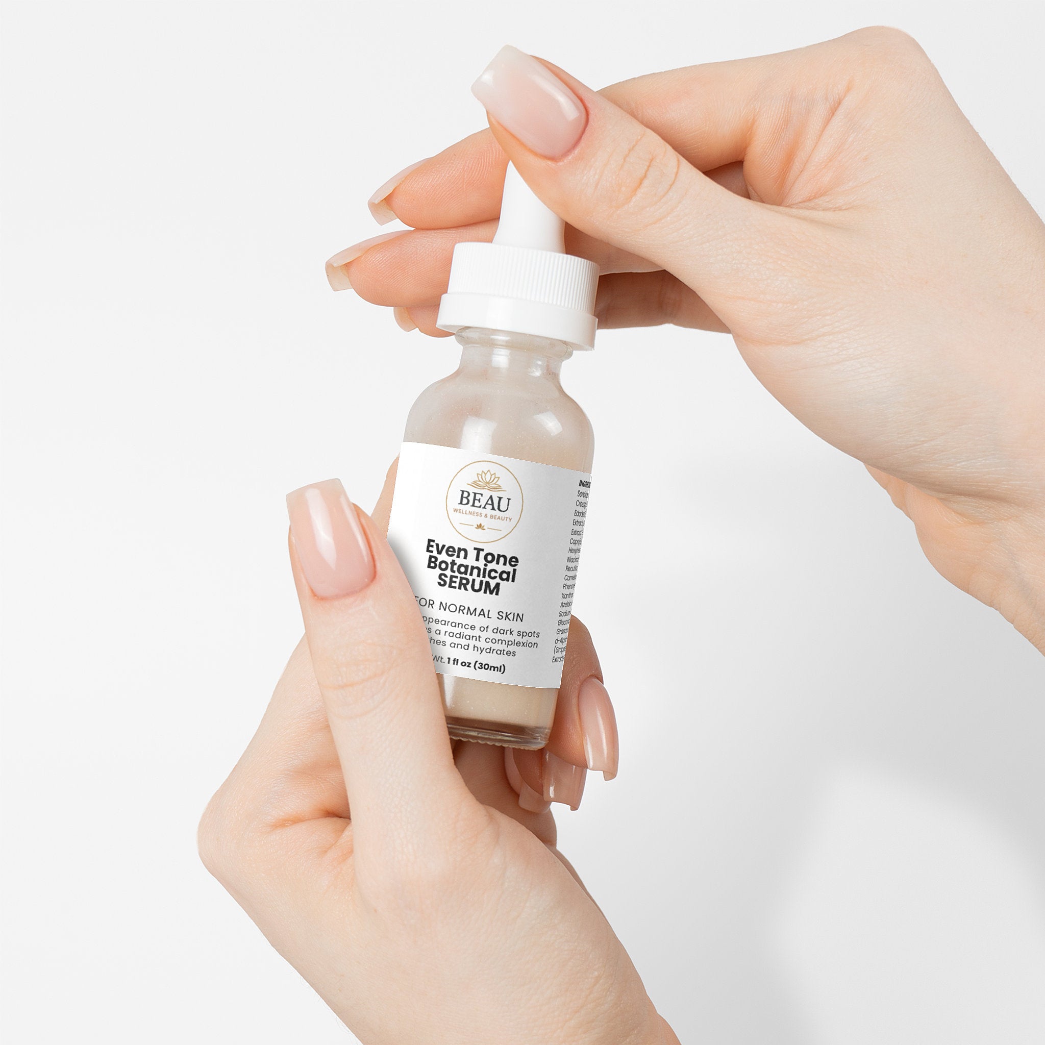 Even Tone Botanical Serum for normal skin.  high-performance brightening serum featuring kojic Acid, Niacinamide, and antioxidant-rich pomegrante seed oil by Beau Wellness & Beauty