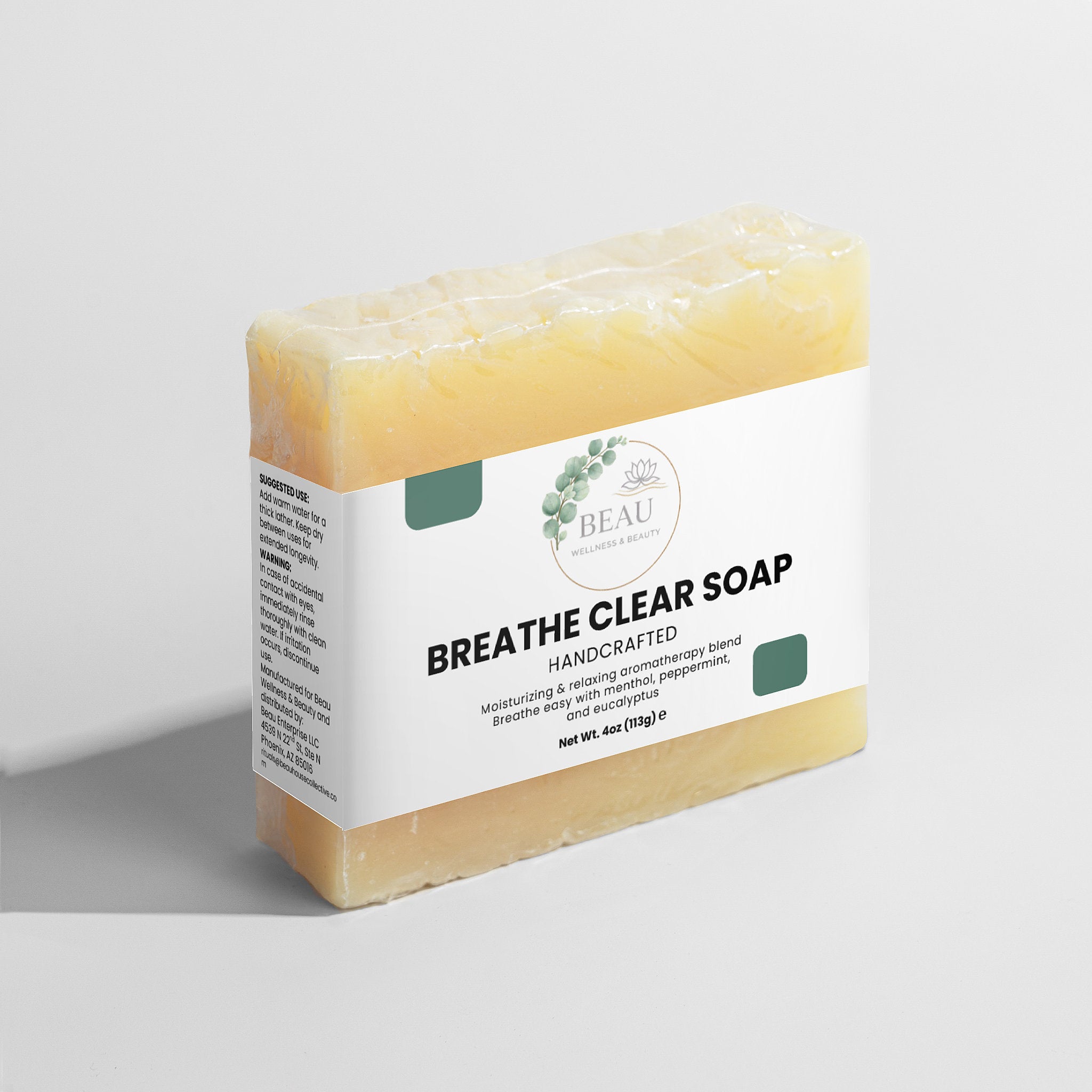Bar of breathe clear soap handcrafted  with a 'BEAU' Wellness & Beauty label on a light gray background