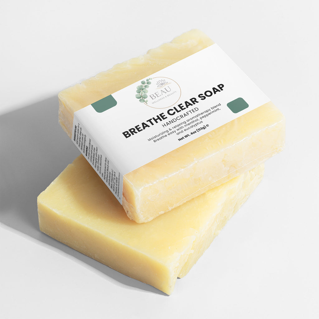Two bars of Beau Wellness & Beauty Breathe  clear soap with perppermint and eucalyptus with  a visible label on a light background