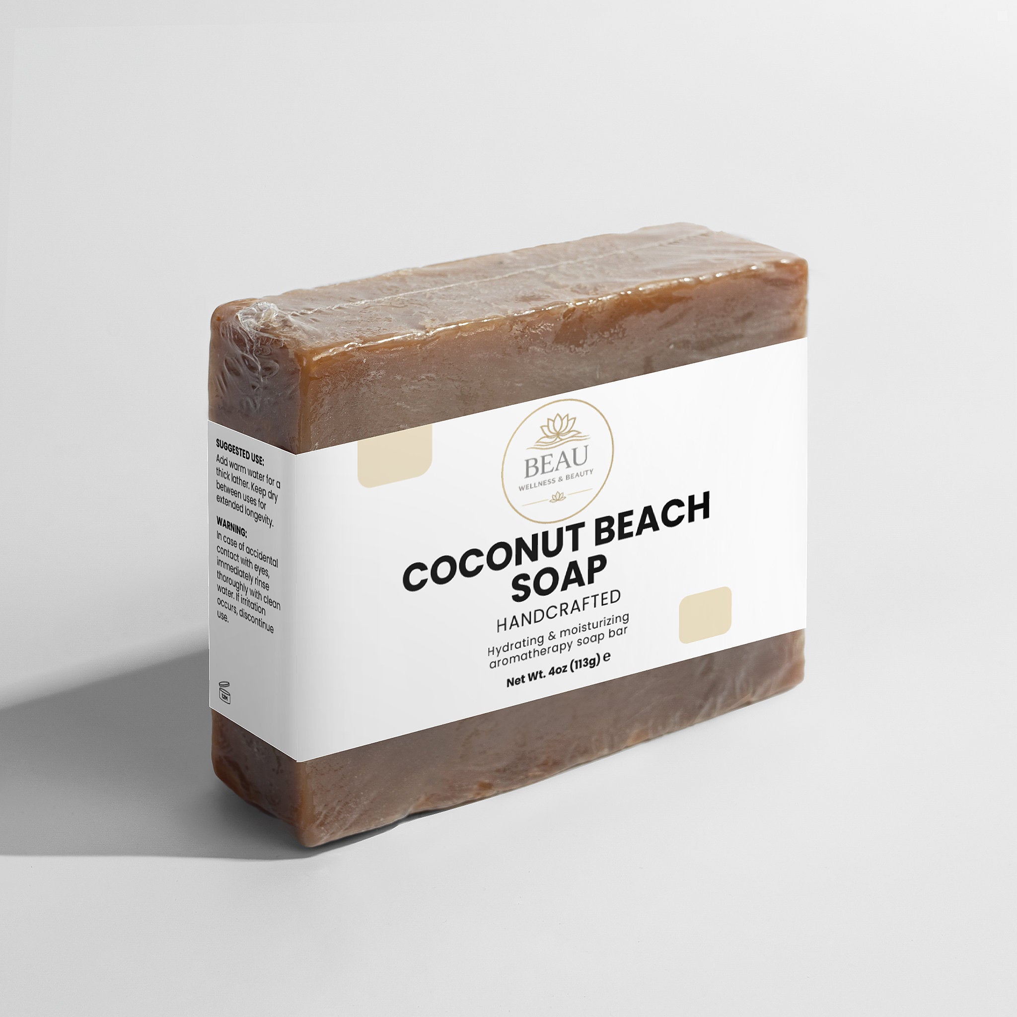 Beau Wellness & Beauty Coconut beach handcrafted  hydrating soap bar with a white label on a light gray background