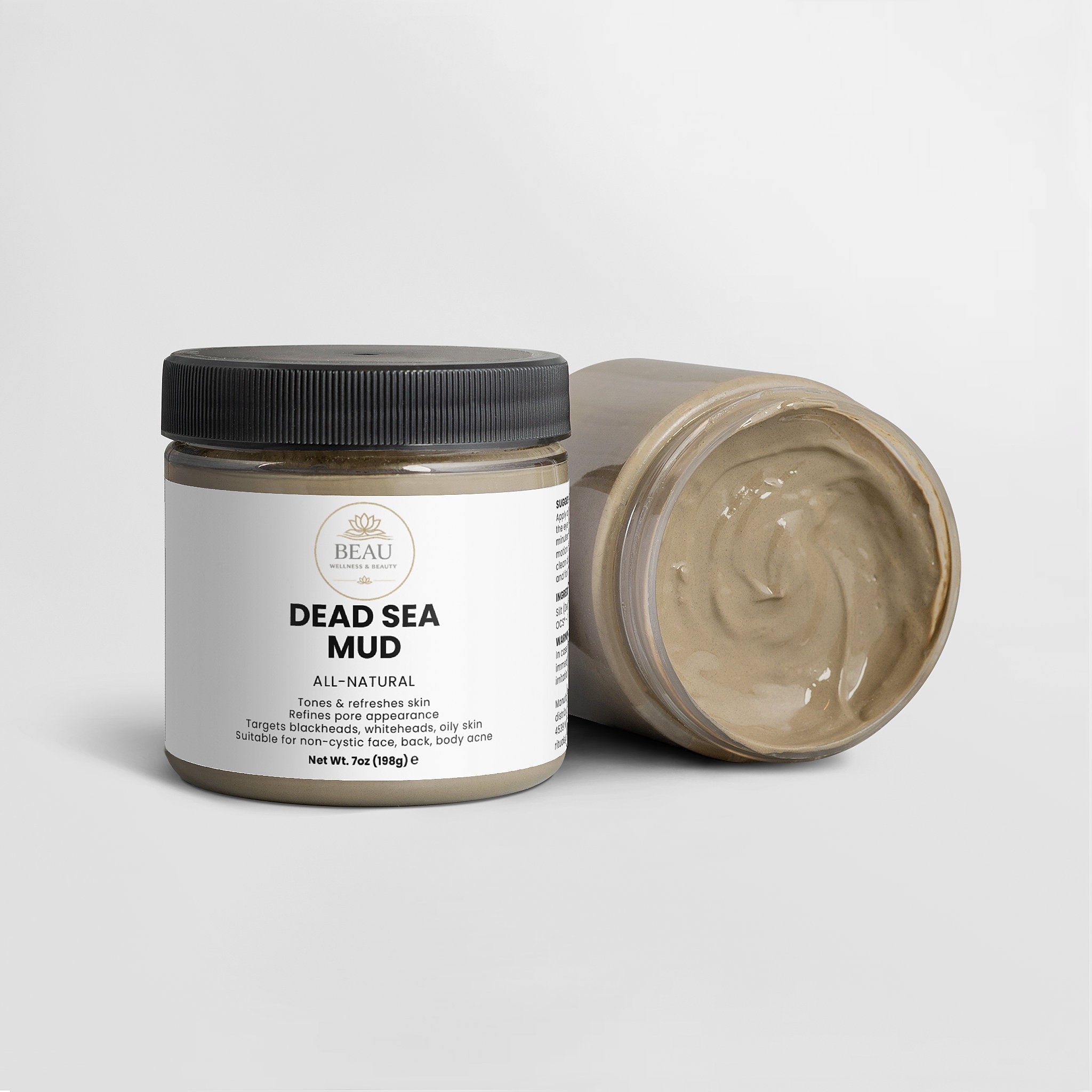 Jar of Dead Sea Mud with a black lid on a white background