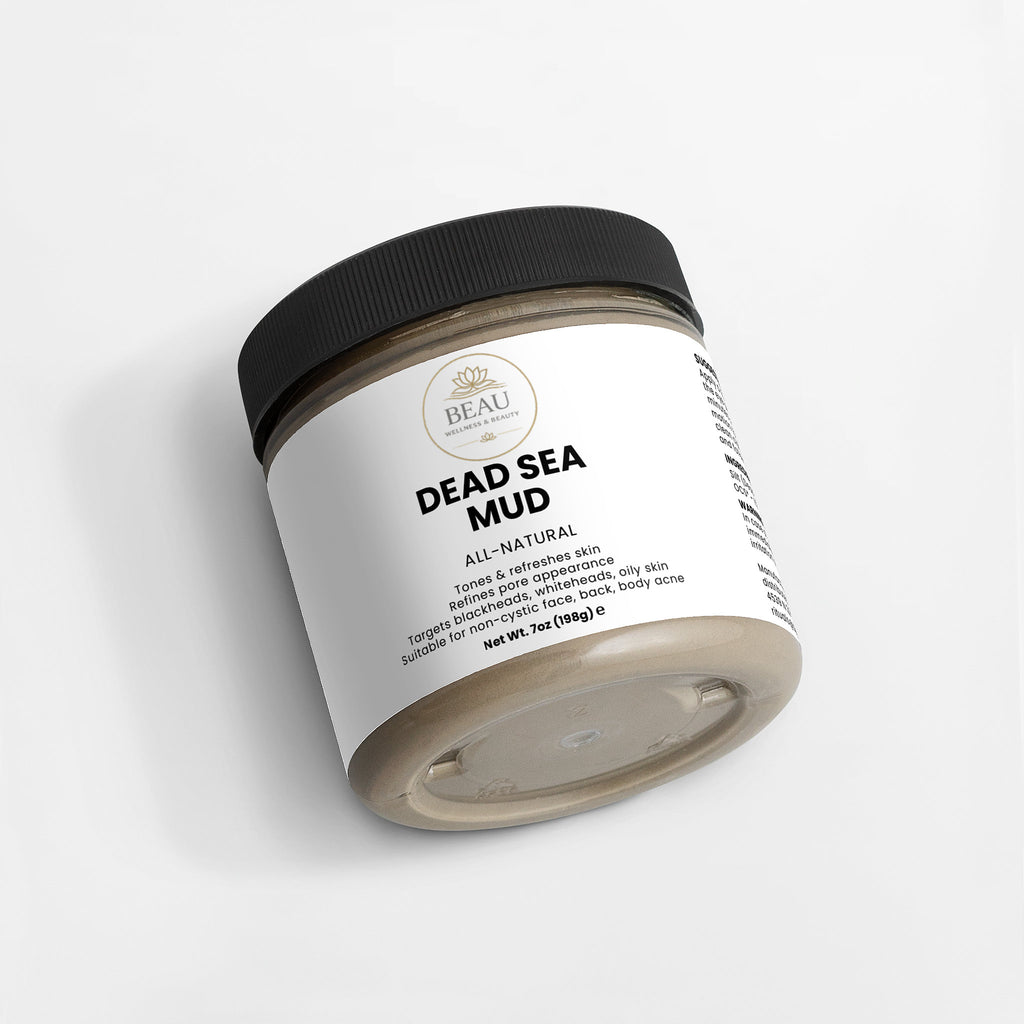 Jar of Dead Sea Mud with a white Beau Wellness & Beauty label on a light gray background