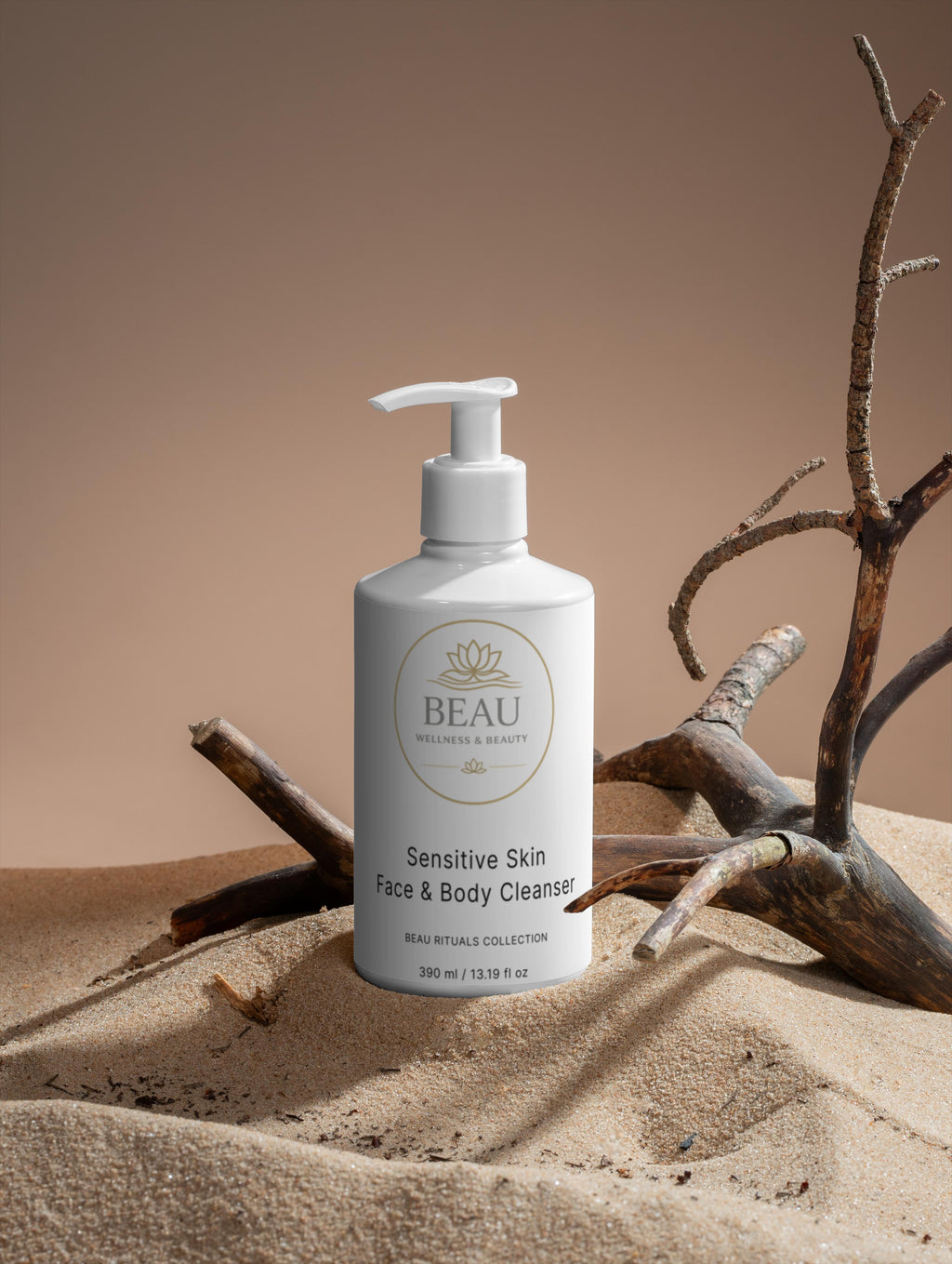 Sensitive skin face and body wash pump bottle on sand with driftwood