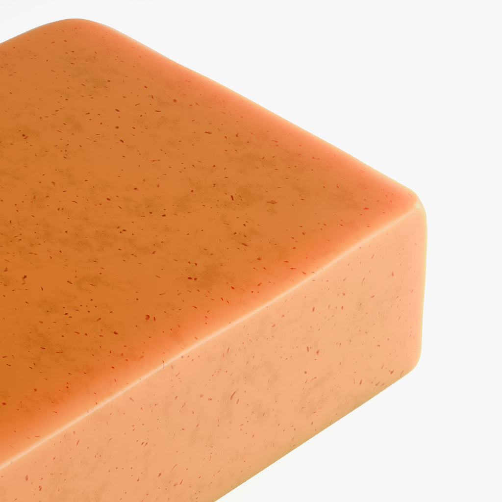 Orange bar of Beau Kojic acid & Turmeric soap on a white background 