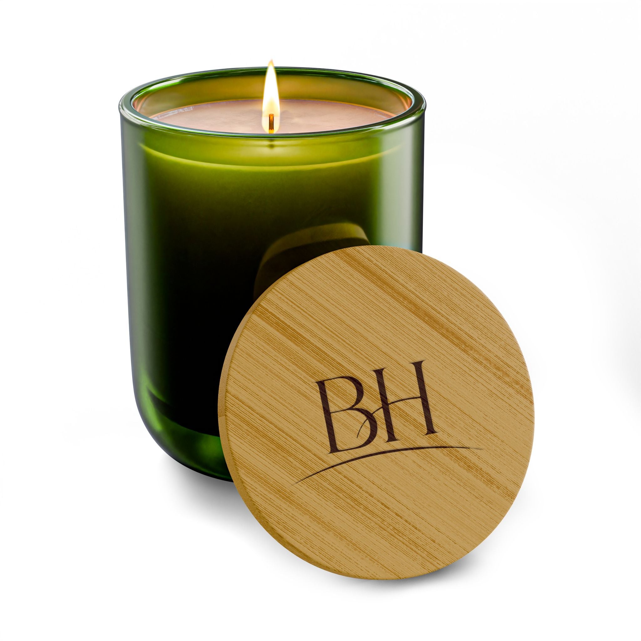 Beau Home Green 14 oz scented soy candle with bamboo lid featuring 'BH' logo on a white background