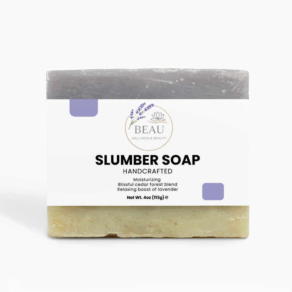 Handcrafted Bar of cedar and lavender soap with packaging labeled 'Slumber Soap' by 'BEAU Wellness & Beauty' on a white background