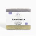 Handcrafted Bar of cedar and lavender soap with packaging labeled 'Slumber Soap' by 'BEAU Wellness & Beauty' on a white background