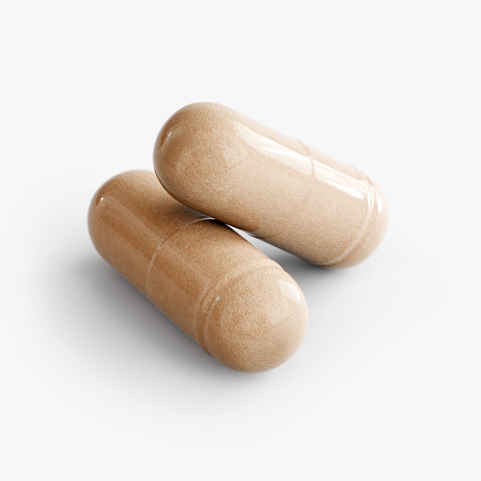 Two loose capsules of Beau Wellness Desire + Vitality Blend Capsules with Horny Goat Weed and Maca⁠ on white background.