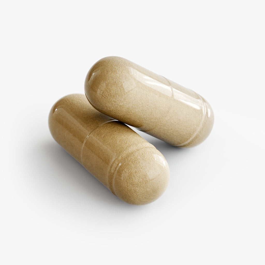 Two loose capsules of Beau Wellness Hair Skin and Nails Essentials Vegan Capsules with Biotin and Zinc⁠ on white background.