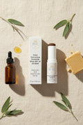 Beau Beauty CC Cream Color Correcting Ceramide Stick SPF 30 in 35 Deep next to packaging on a textured background with natural botanicals.