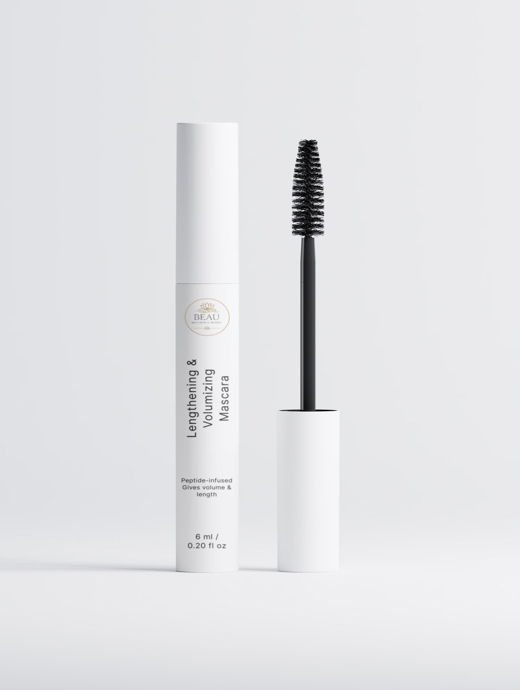 Beau Beauty Lengthening & Volumizing Mascara with white casing and black brush on a light gray background