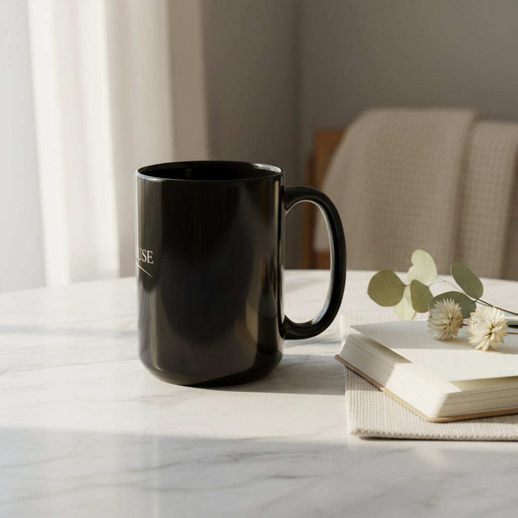 Black mug with Beau House Collective graphics on a white background 