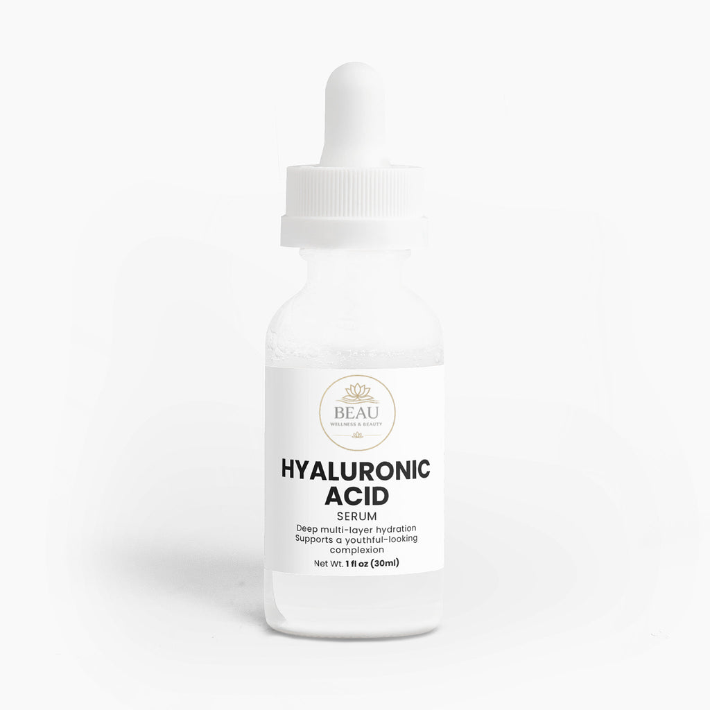 A glass bottle of Beau Wellness & Beauty Hyaluronic Acid Serum with a white dropper cap, featuring a clean label that highlights deep multi layer hydration for a youthful-looking complextion