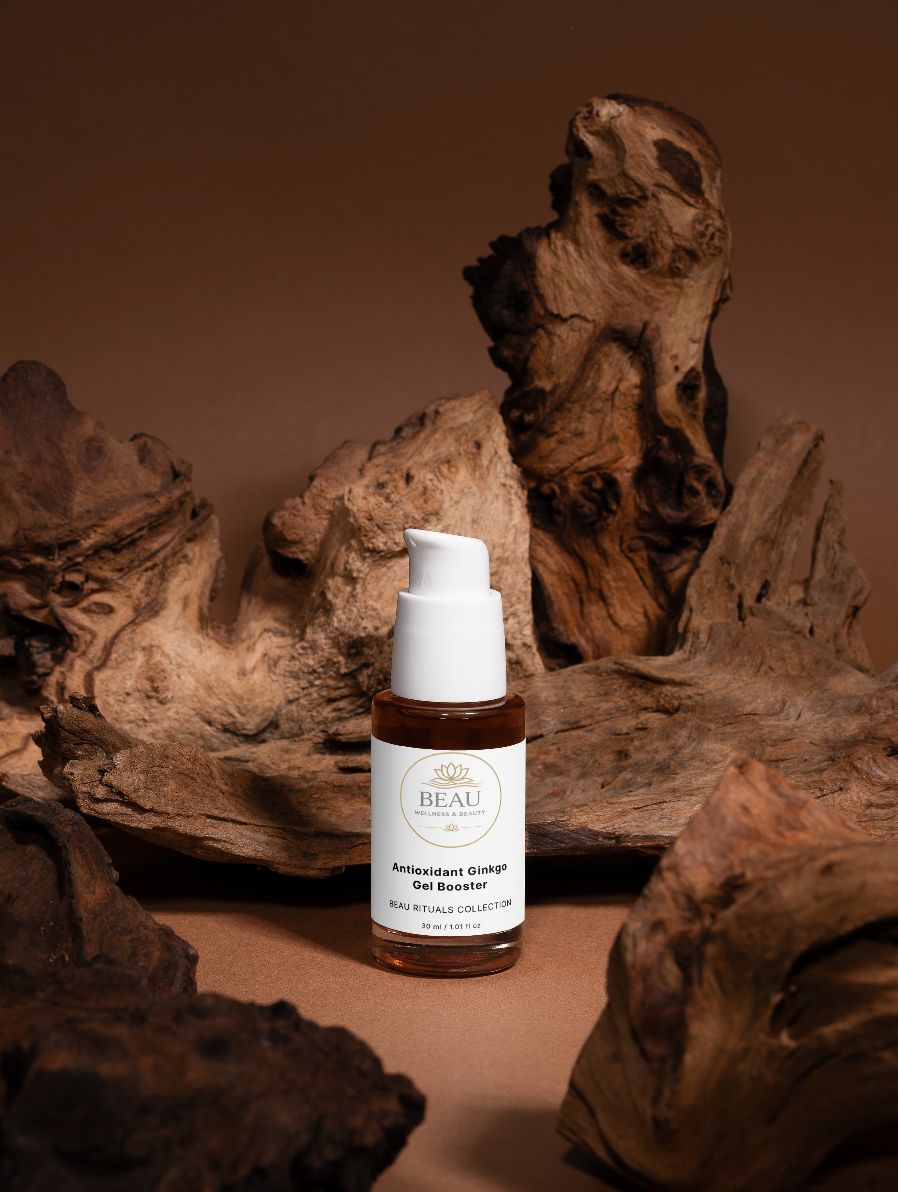 Beau Wellness & Beauty Antioxidant Ginkgo Gel Booster Face Serum Skincare bottle with a white cap and label on a brown background with natural wood elements.