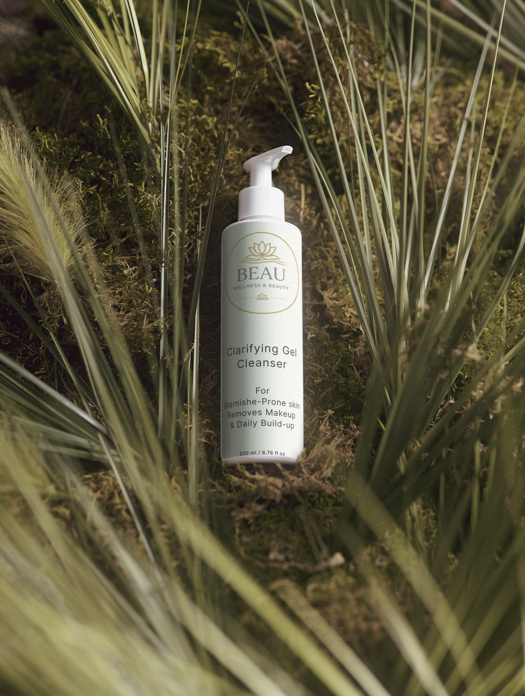 Beau Wellness & Beauty Clarifying Gel Cleanser among grass and moss