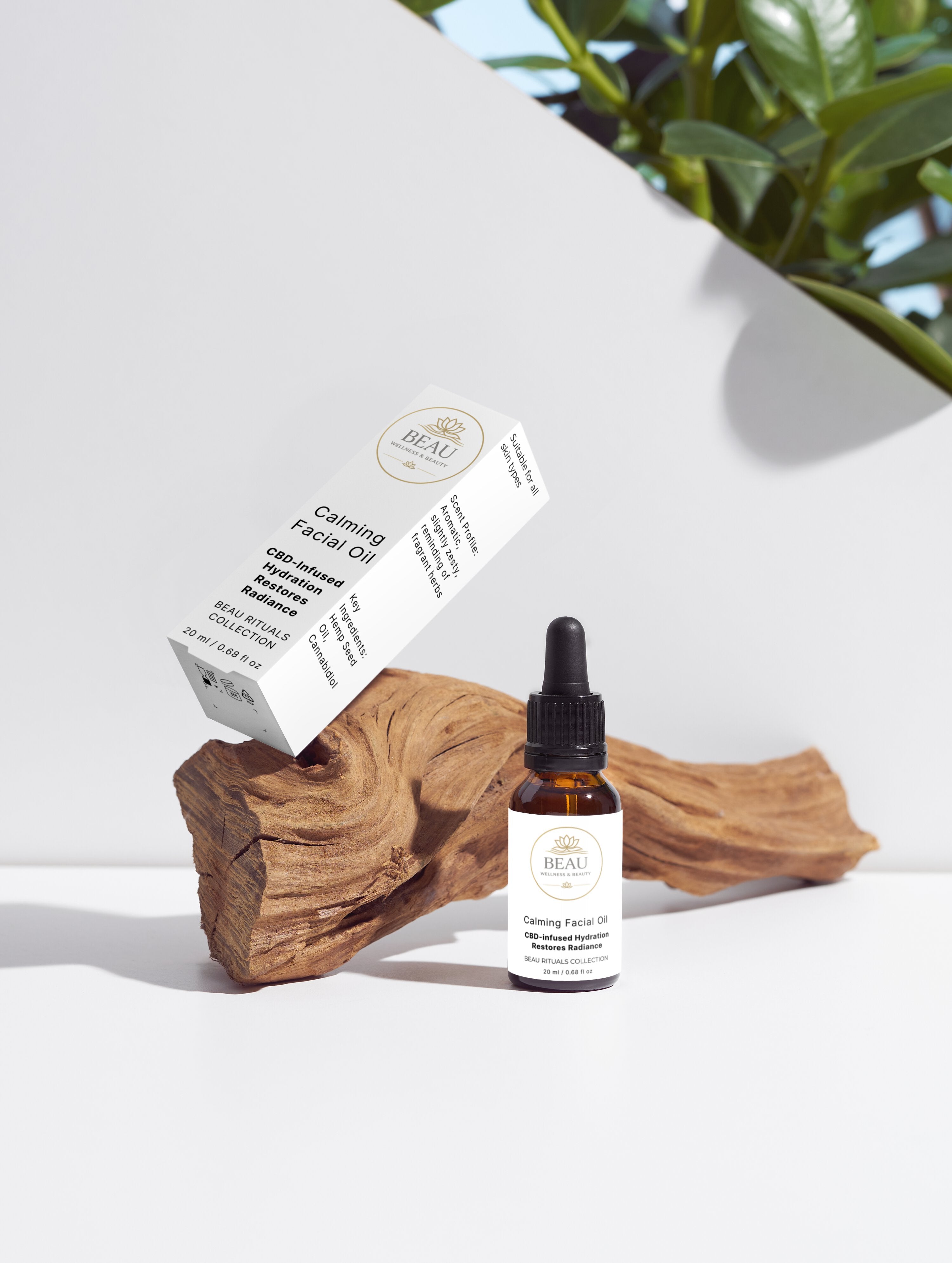 Beau Calming Facial Oil with CBD and hemp seed oil skincare product with a dropper bottle and box on a wooden block with a plant in the background.
