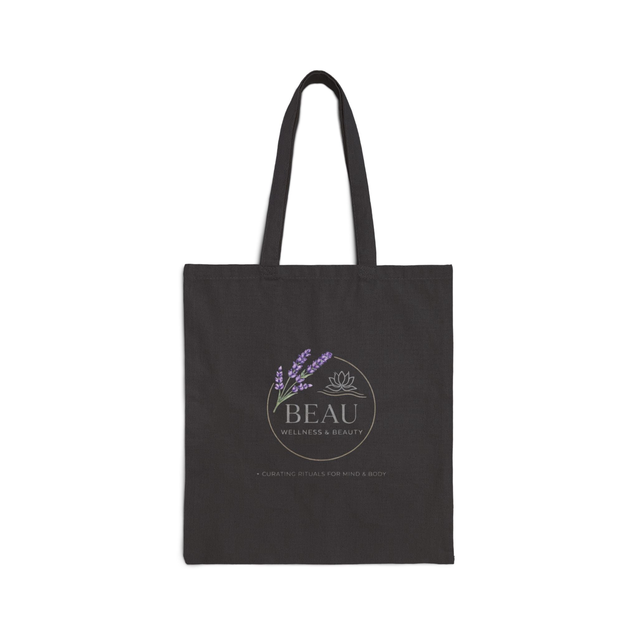 Black Canvas tote bag with 'BEAU Wellness & Beauty' logo on a white background