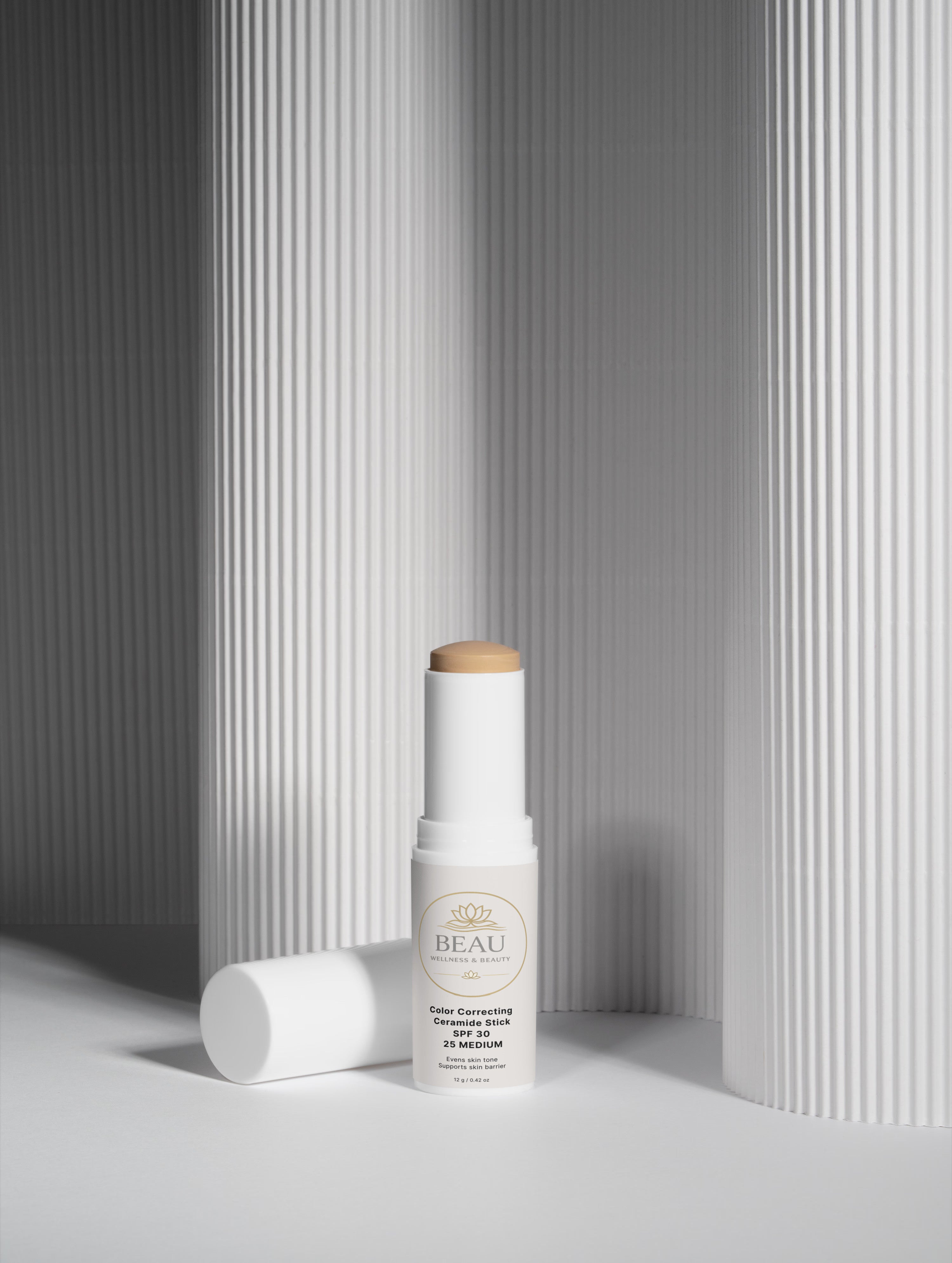 Beau Wellness & beauty CC Ceramide Stick with SPF 30 , shade medium 25  on white lined shadowed background.