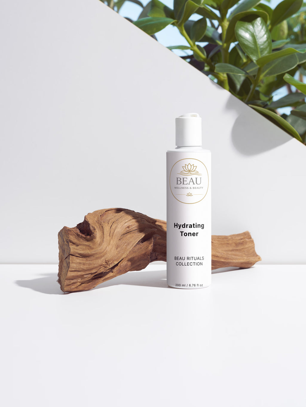 Bottle of Beau Wellness & Beauty Hydrating toner with Hyaluronic Acid on a white surface with natural elements