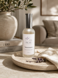 Beau Wellness & eauty Sanctuary Linen & Room Spray featuring notes of lavender, lemongrass, and white tea in a luxury home setting
