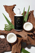 Beau Wellness & Beauty Moisturizing Shampoo with Aloe and Coconut on wooded background.