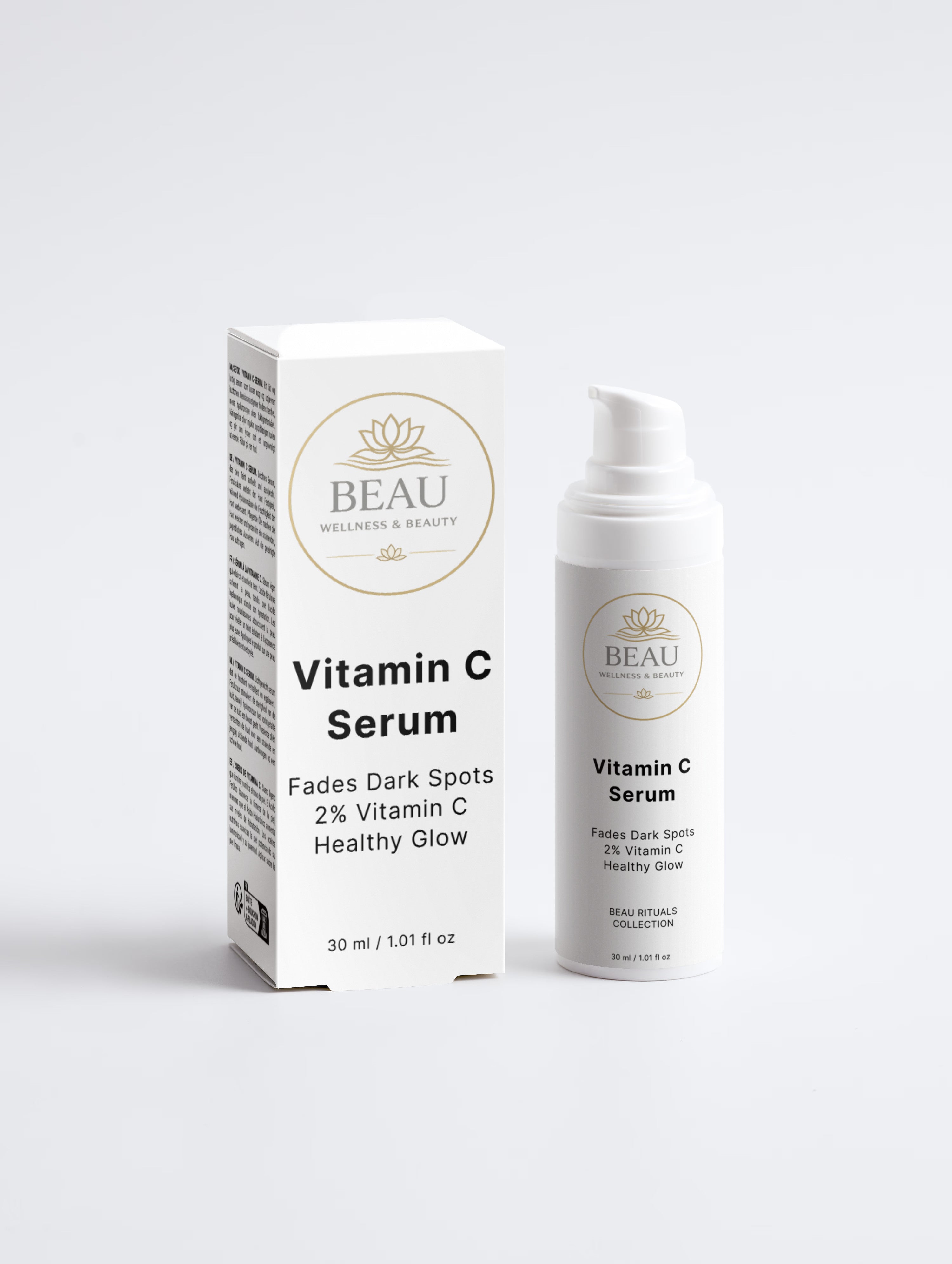 A white cosmetic box and matching pump bottle of BEAU Vitamin C Serum on a clean light gray studio background.