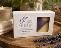 Box of BEAU Wellness & Beauty Lavender Lemongrass handcrafted cold process soap on a wooden surface with lavender flowers.
