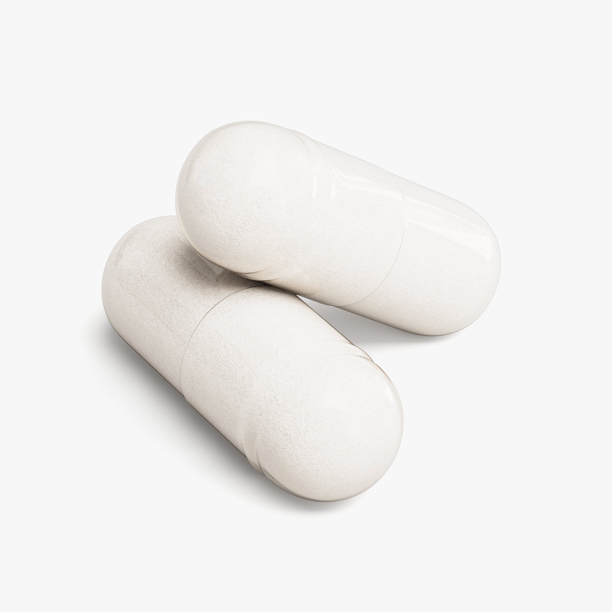 Two white capsules of Beau Wellness Magnesium Glycinate on a light gray background