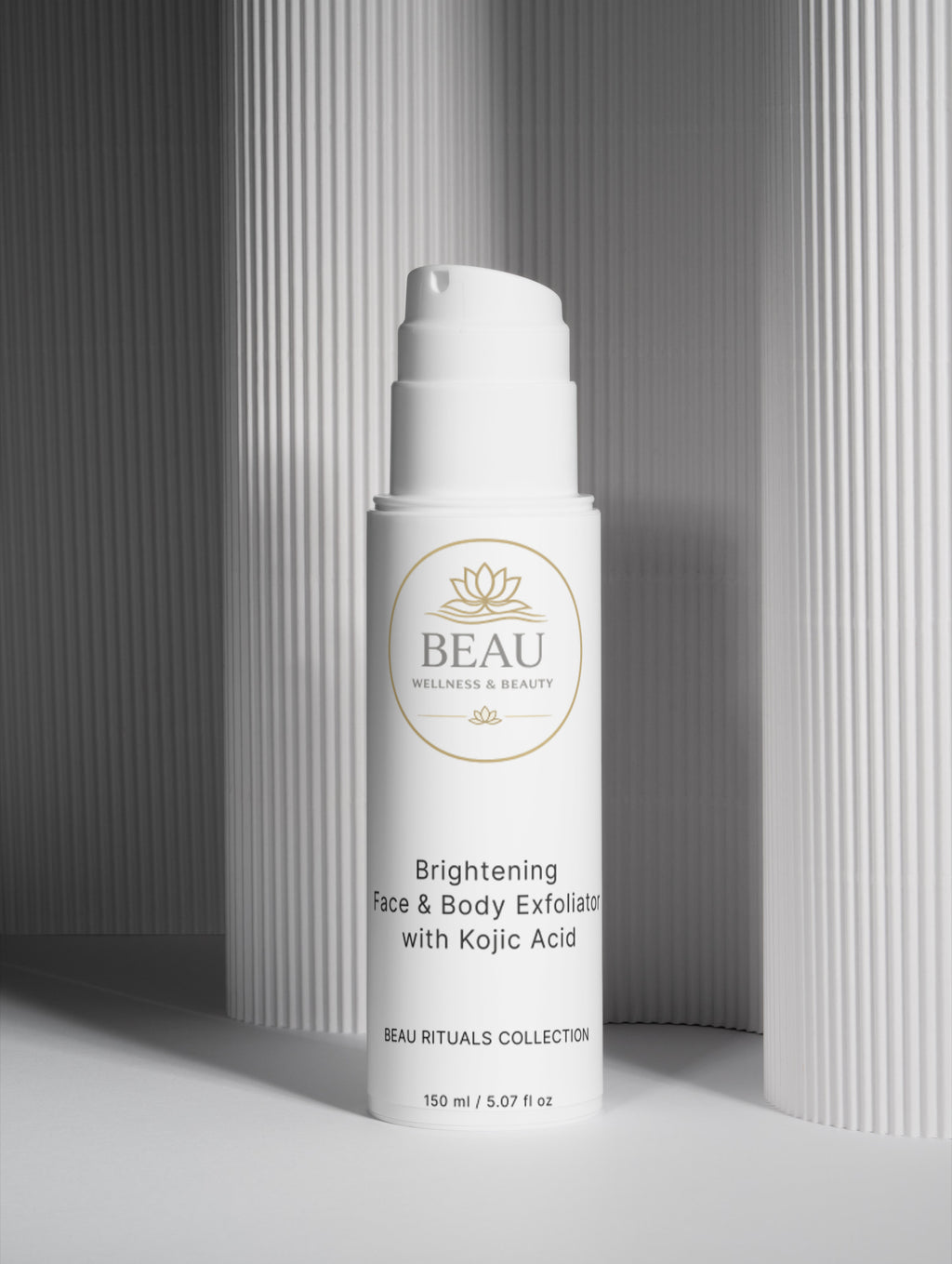 Beau Wellness & Beauty Brightening Face & Body Exfoliator with kojic acid on a lined colum background. 