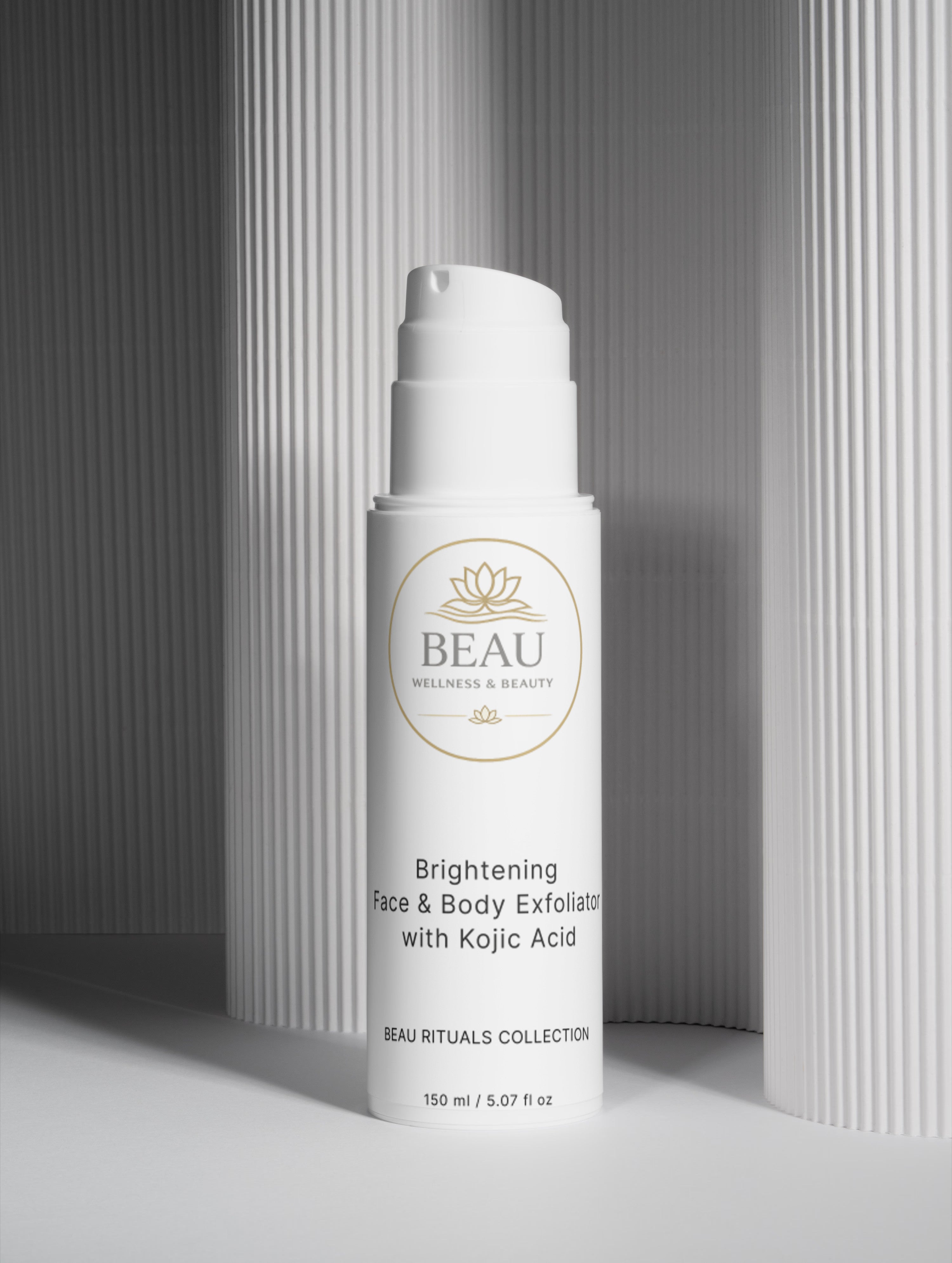 Beau Wellness & Beauty Brightening Face & Body Exfoliator with kojic acid on a lined colum background. 