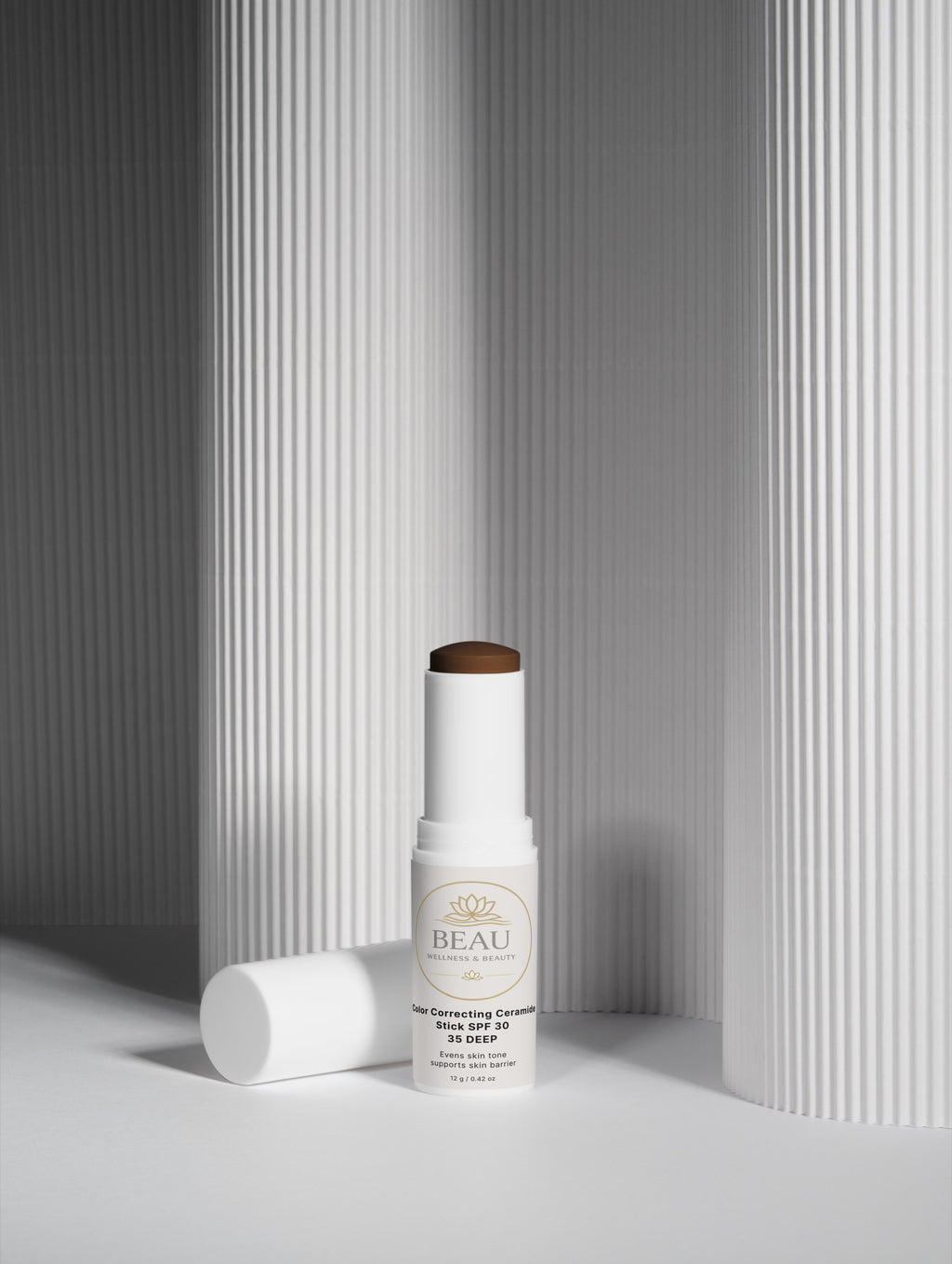 Beau Beauty CC Cream Color Correcting Ceramide stick SPF30 shade 35 deep Skincare product with a white container and beige label on a gray background
