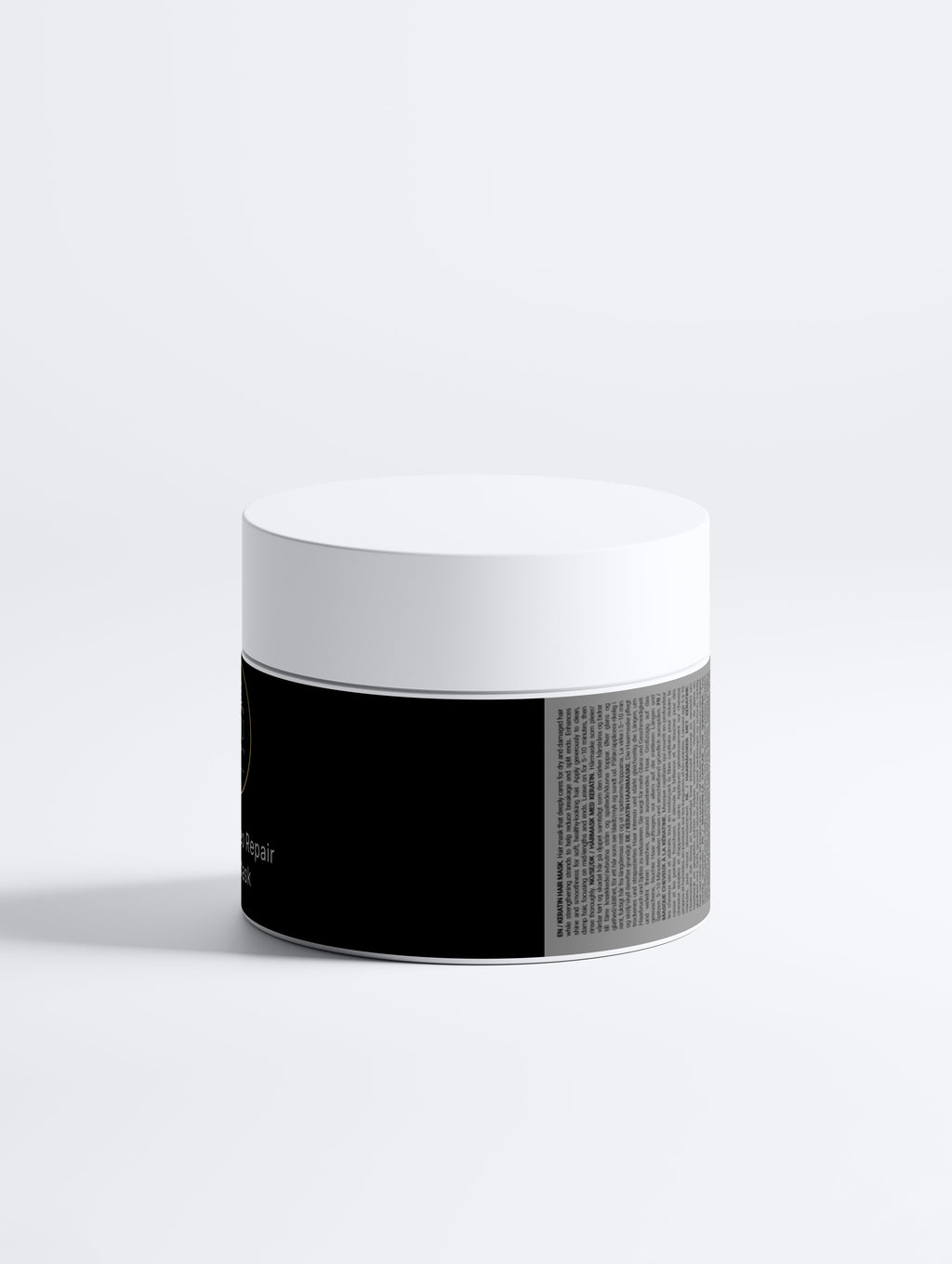 Beau Wellness & Beauty Keratin Deep Repair Hair Mask for dry and damaged hair, featuring hydrolyzed keratin and botanical oils. Showing back of jar text.