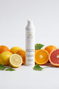 Beau Wellness & Beauty Niacinamide Gel Moisturizer on white background with citrus fruits and ginkgo leaves.