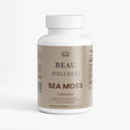Beau Wellness Organic Sea Moss Capsules with Bladderwrack, Burdock Root, and BioPerine for thyroid, immune, and energy support on white background.