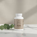 Three bottles of Beau Wellness Ox Bile Complex capsules with DigeZyme and Artichoke Extract for healthy fat digestion and gallbladder support on white background.