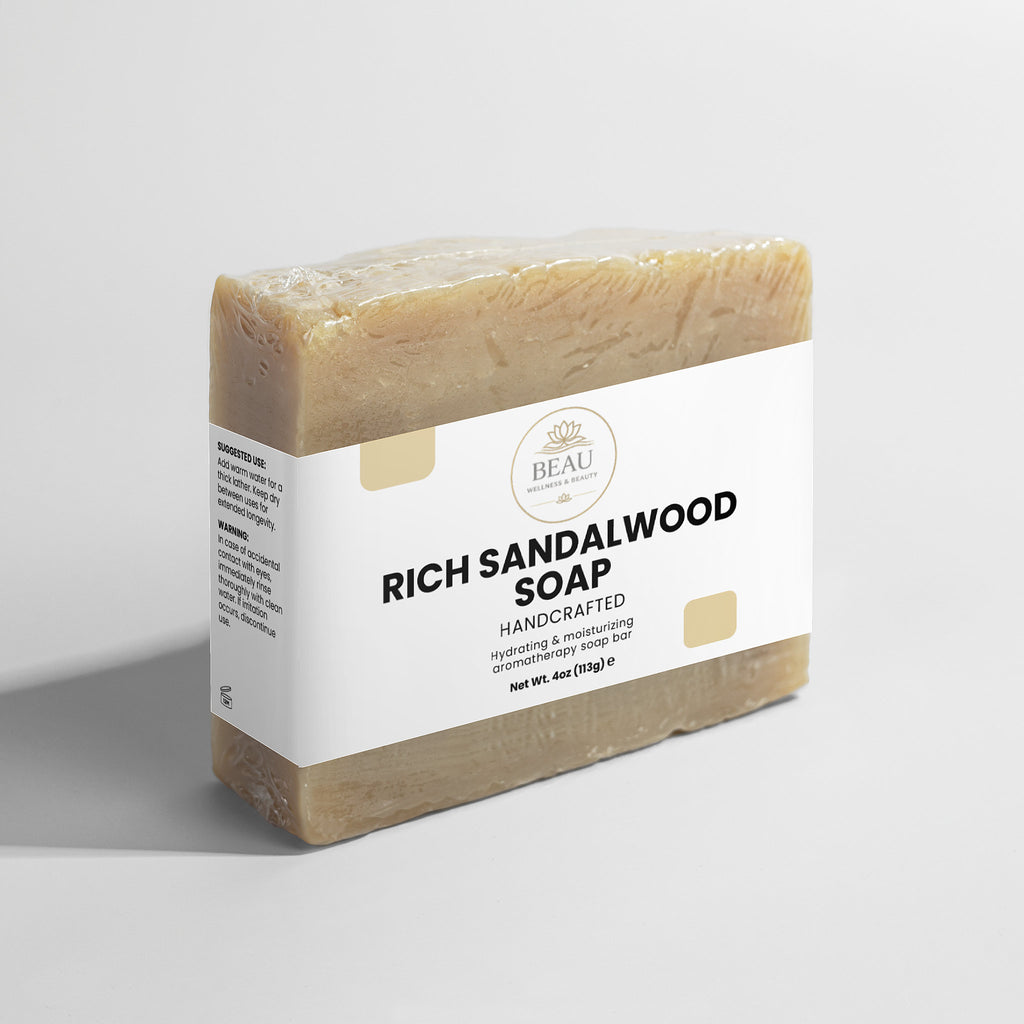 Bar of Rich Sandalwood Soap handcrafted with a white label on a light gray background