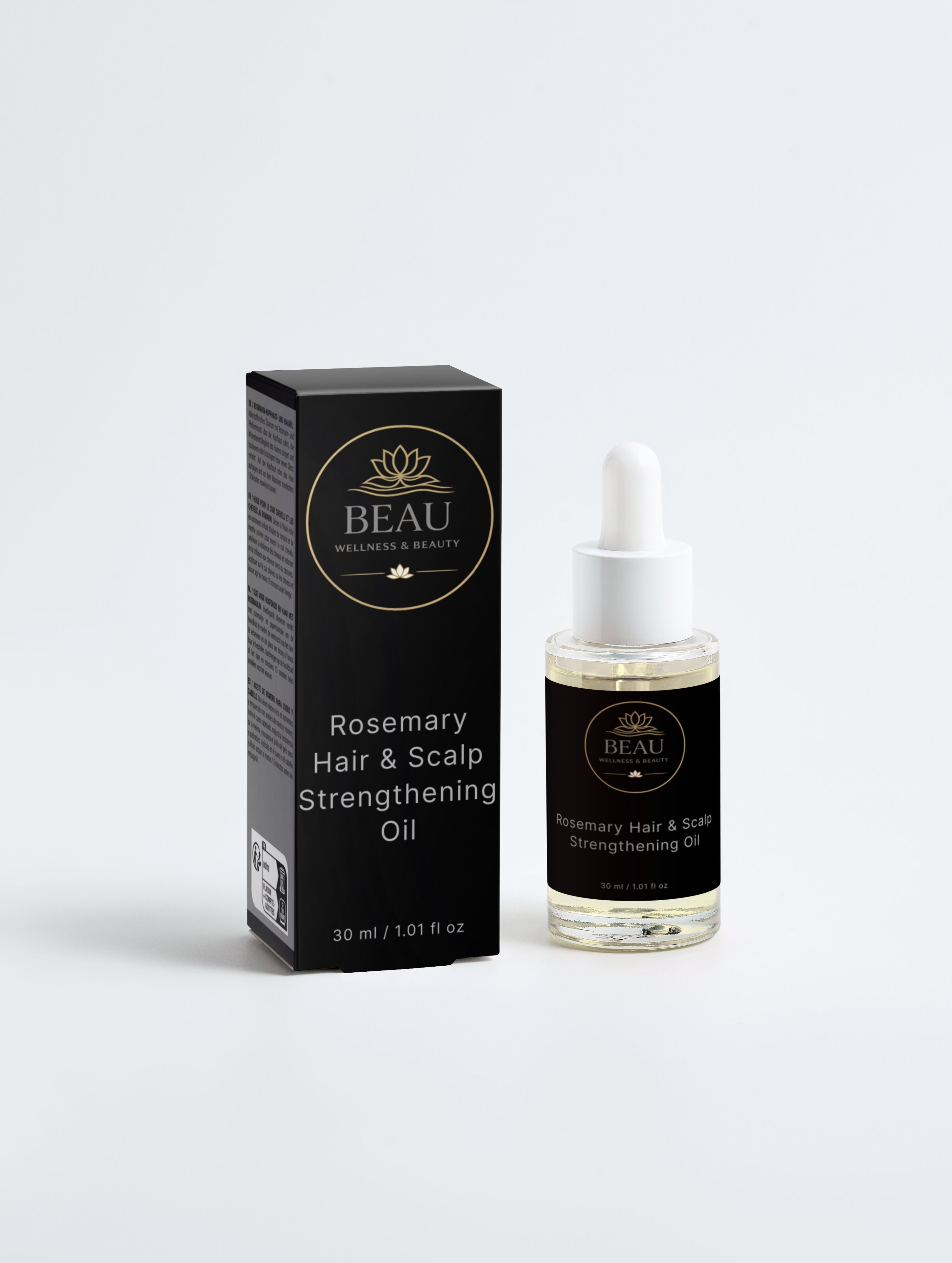 Beau Wellness & Beauty Rosemary Hair and Scalp Strengthening Oil in a clear glass dropper bottle next to its luxury black and gold branded packaging.