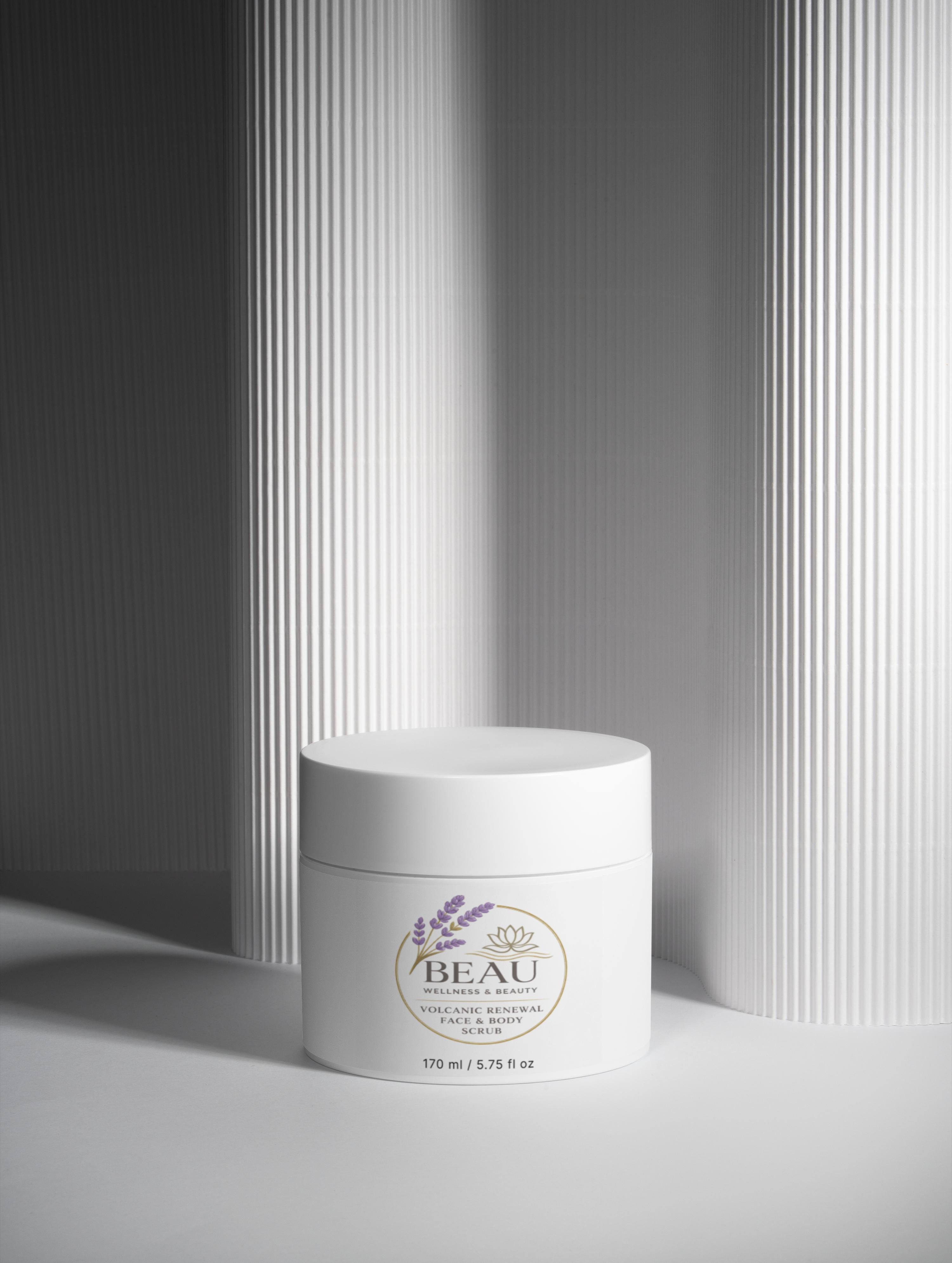 BEAU Volcanic Renewal Face & Body Scrub in a minimalist white jar with lavender botanical illustration.